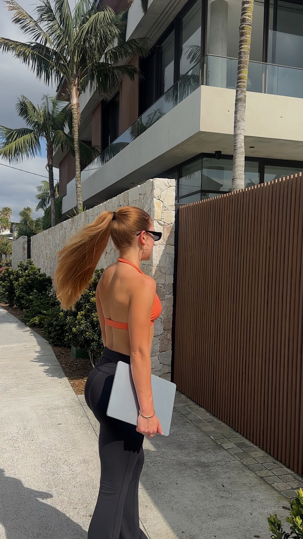 Your Daily Habits Create Your Reality – personal wellness photo of Cat Martin in activewear, sharing healthy lifestyle habits